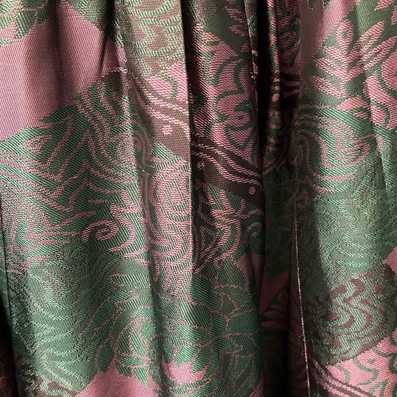 Skirt waistband is elastic colors purple &green. Skirt is below the knee midi - Picture 3 of 7